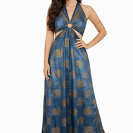 Woman wearing a blue and gold patterned halter neck dress on a white background