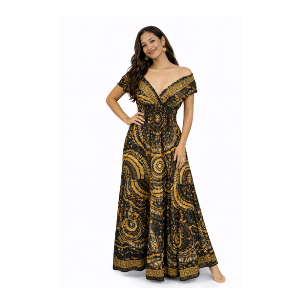 Woman wearing a black and gold patterned off-shoulder dress on a white background