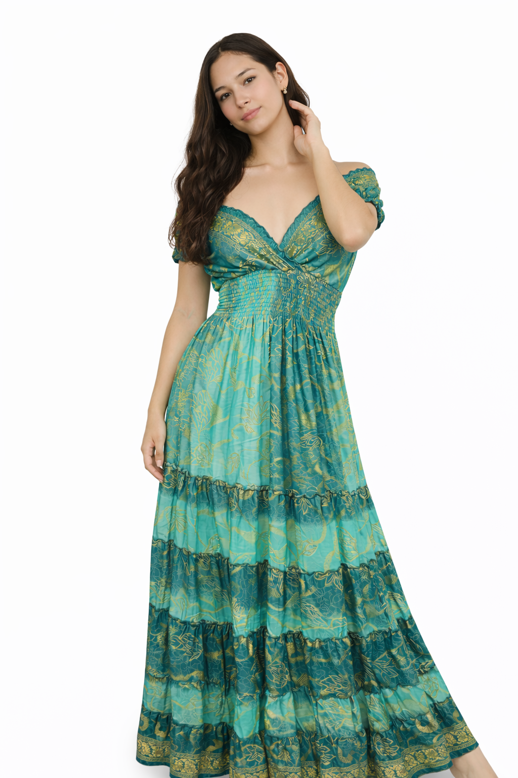 Woman wearing a green patterned dress on a white background